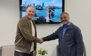 Benchmark Gensuite CEO R. Mukund shaking hands with Anvl CEO