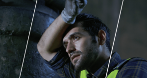 Employee wearing personal protective gear working in hot temperatures