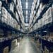 Photo of an aisle of a busy warehouse