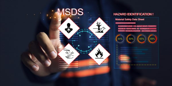 Safety officers pointing hands at the MSDS or material safety data sheet to indicate chemical information, basic antidotes or hazards to the body in area of use for emergency case safety work concept