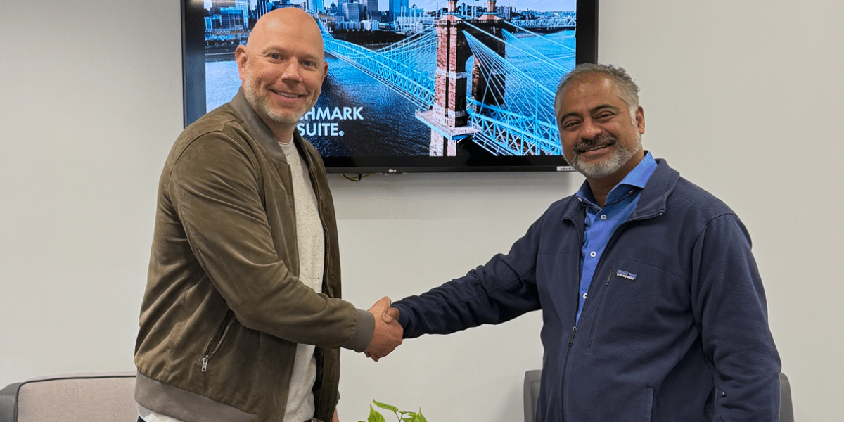 Benchmark Gensuite CEO R. Mukund shaking hands with Anvl CEO