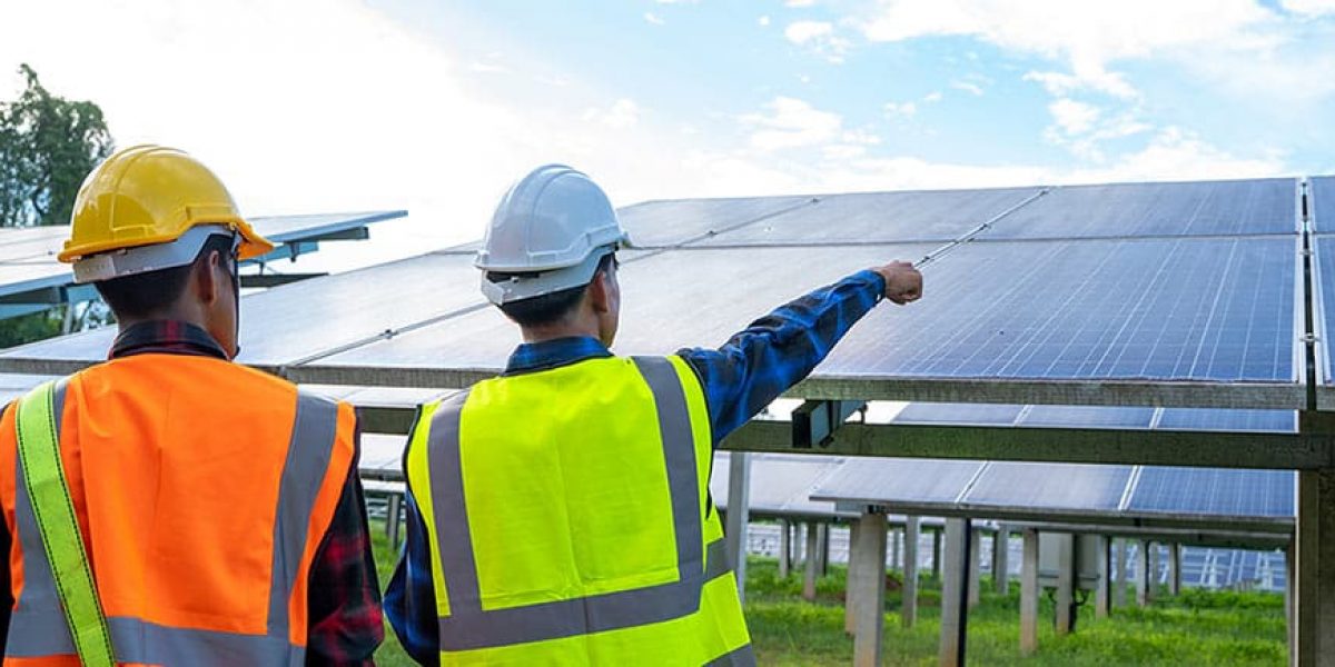 Workers Pointing at Solar Panel