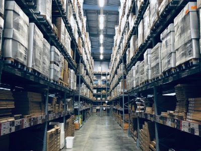 Photo of an aisle of a busy warehouse